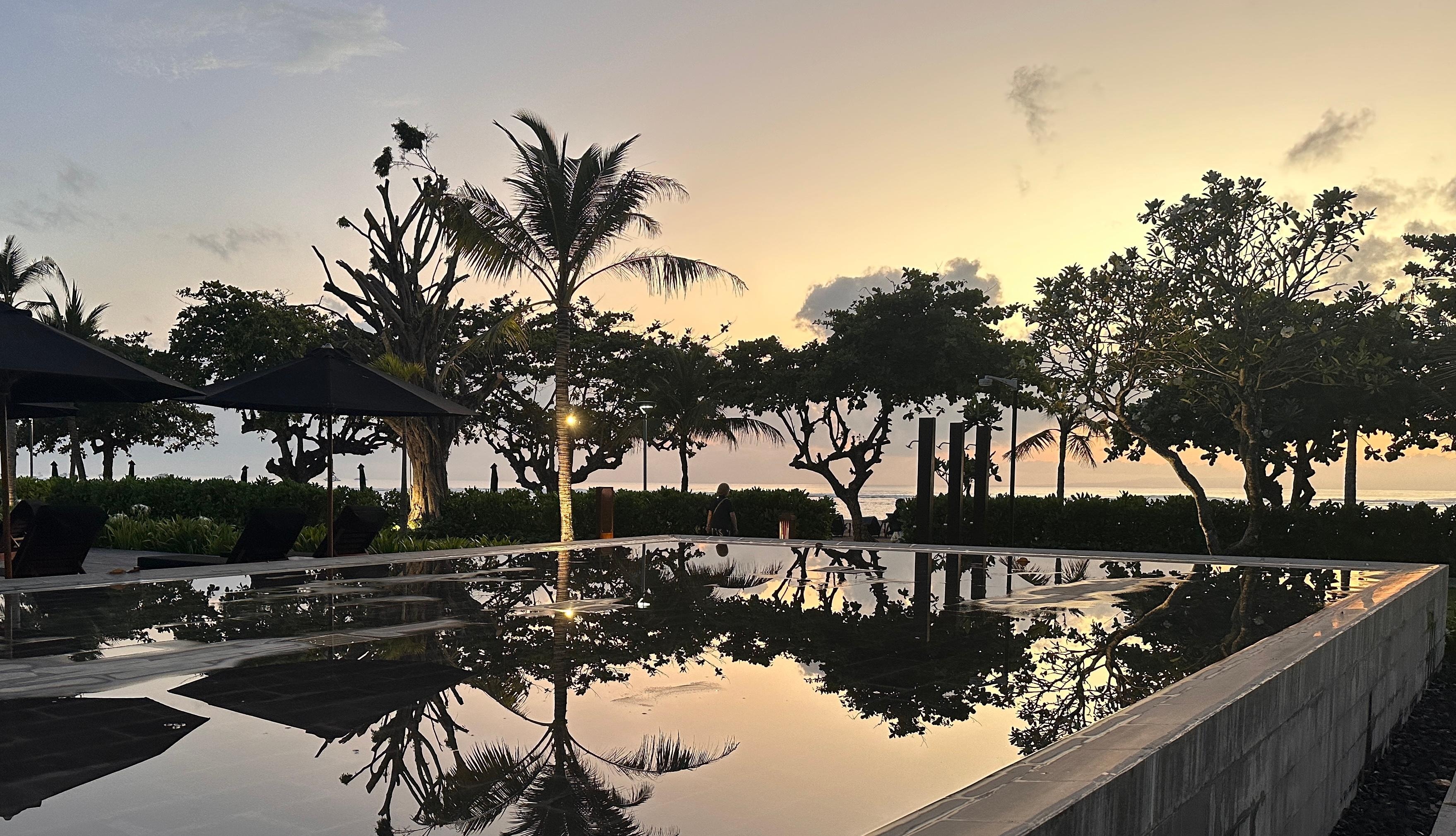 Hotel pool at sunrise 