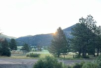 Watching the sunrise over Mount Olympus while sitting on the deck with a cup of coffee.