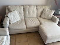 Couch worn out and dirty.