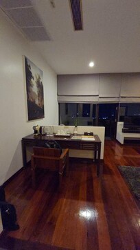 The room with polished wood flooring.