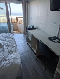 Your kitchen area is a long counter with a microwave and mini fridge