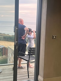 Granddad and Grandson enjoying the views from the living room balcony