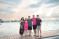 Off the pier family shot at sunset