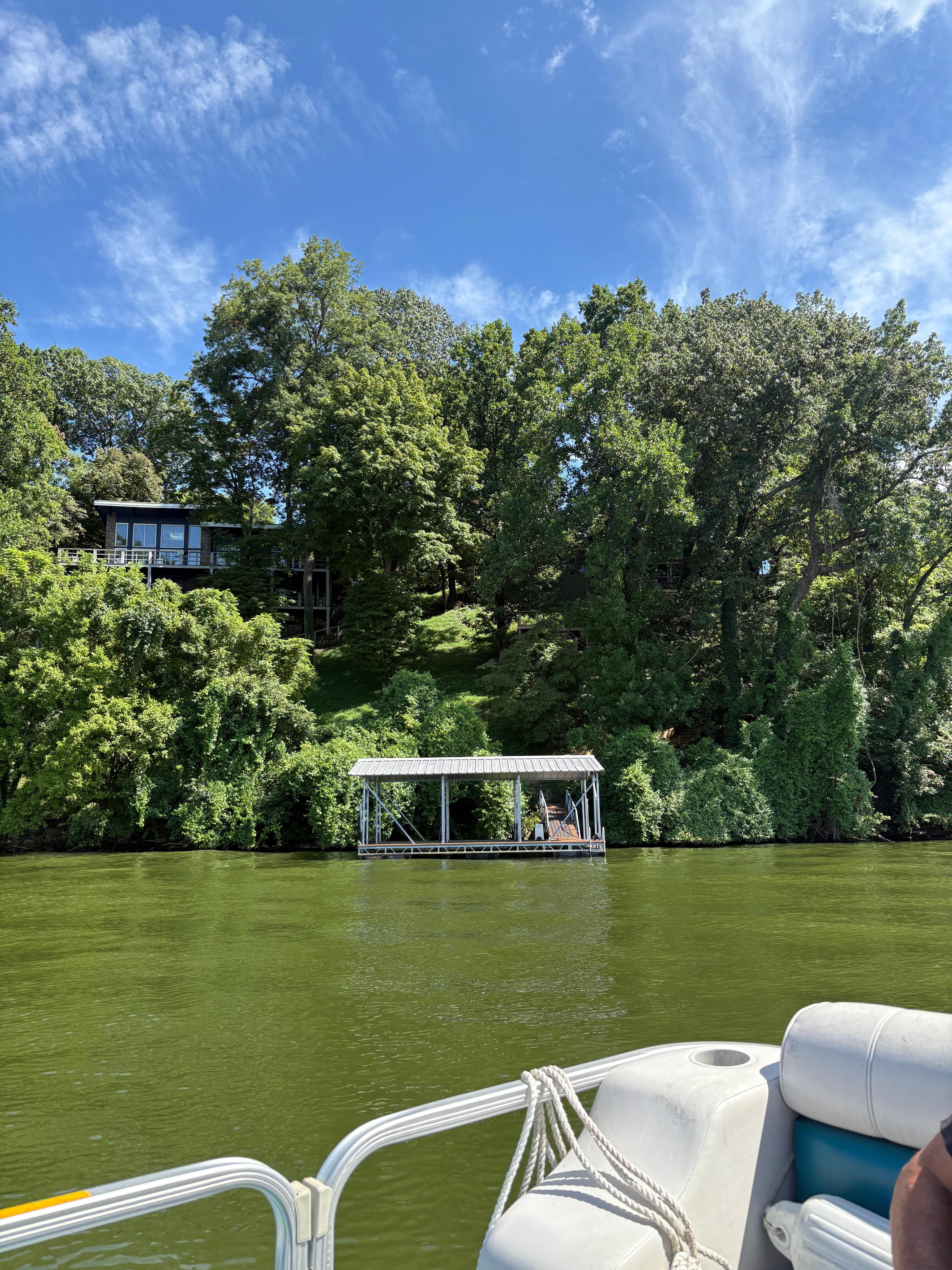 View of dock and house from lake