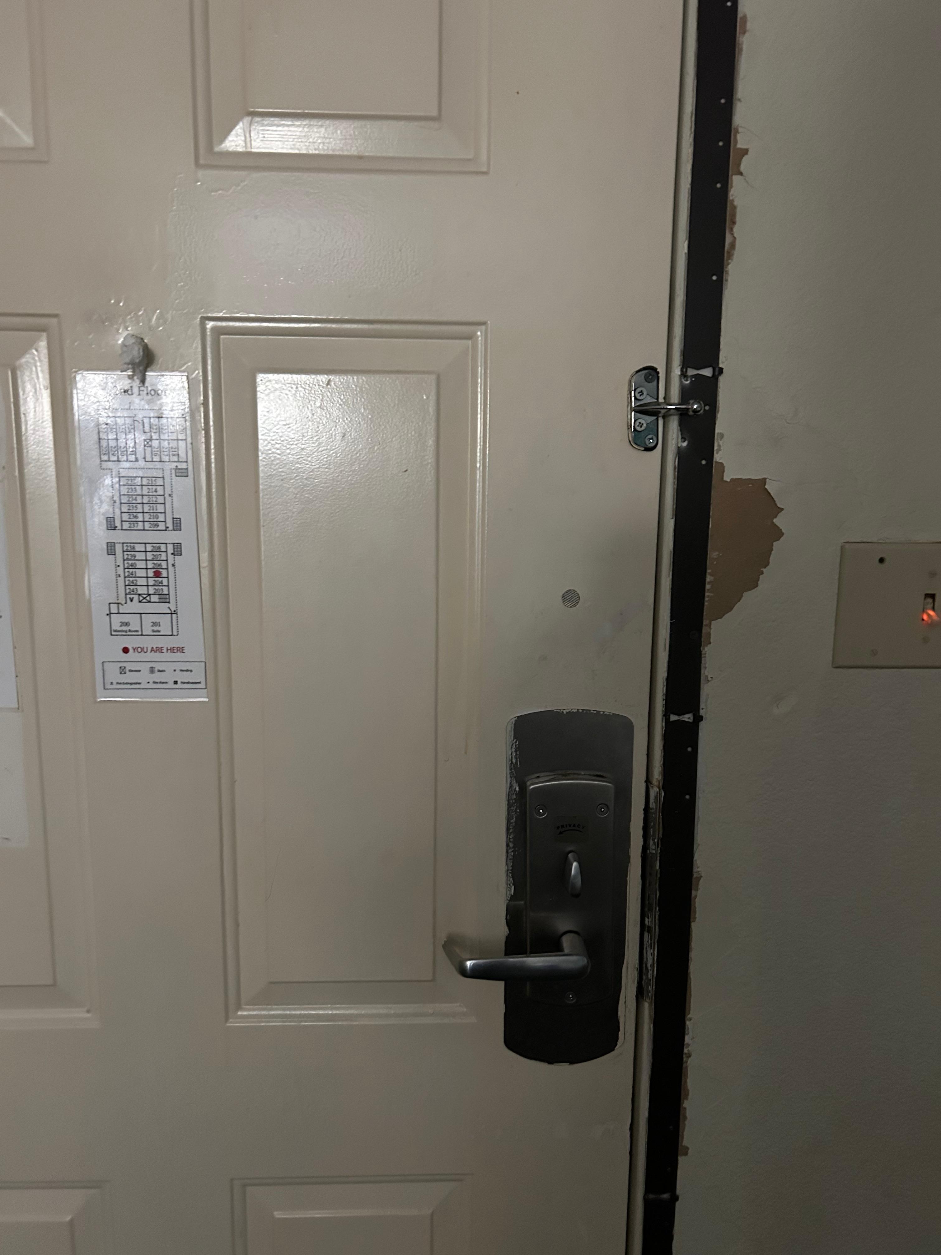 Door from inside - lock ripped off and peep hole covered. 