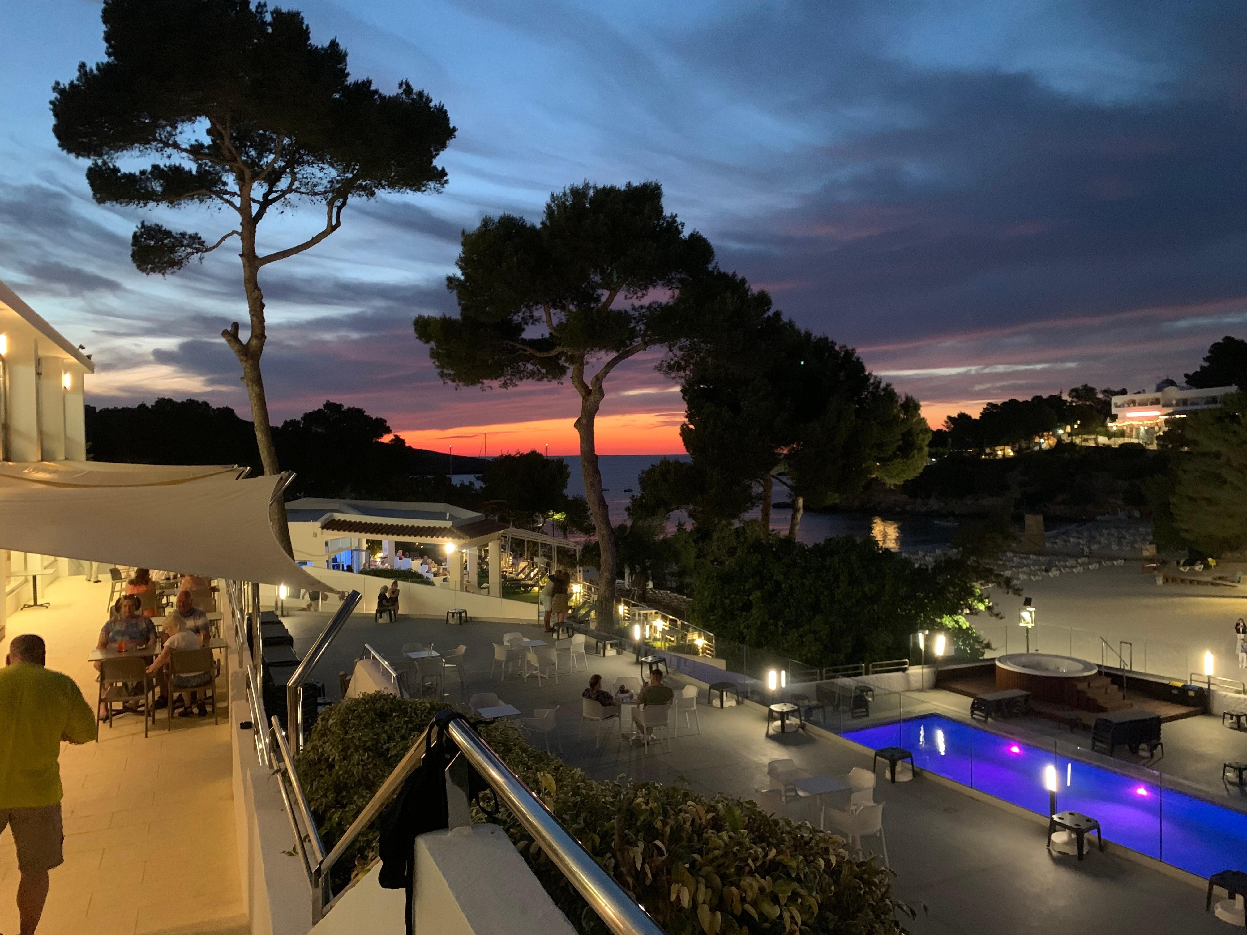 Sunset from Hotel terrace, facing towards the beach.