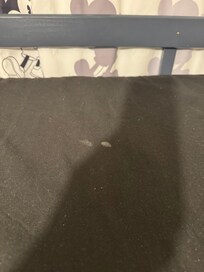 Mysterious white stain on comforter in kids' bunk room.