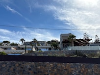 Looking up at the Cretan from the street below.