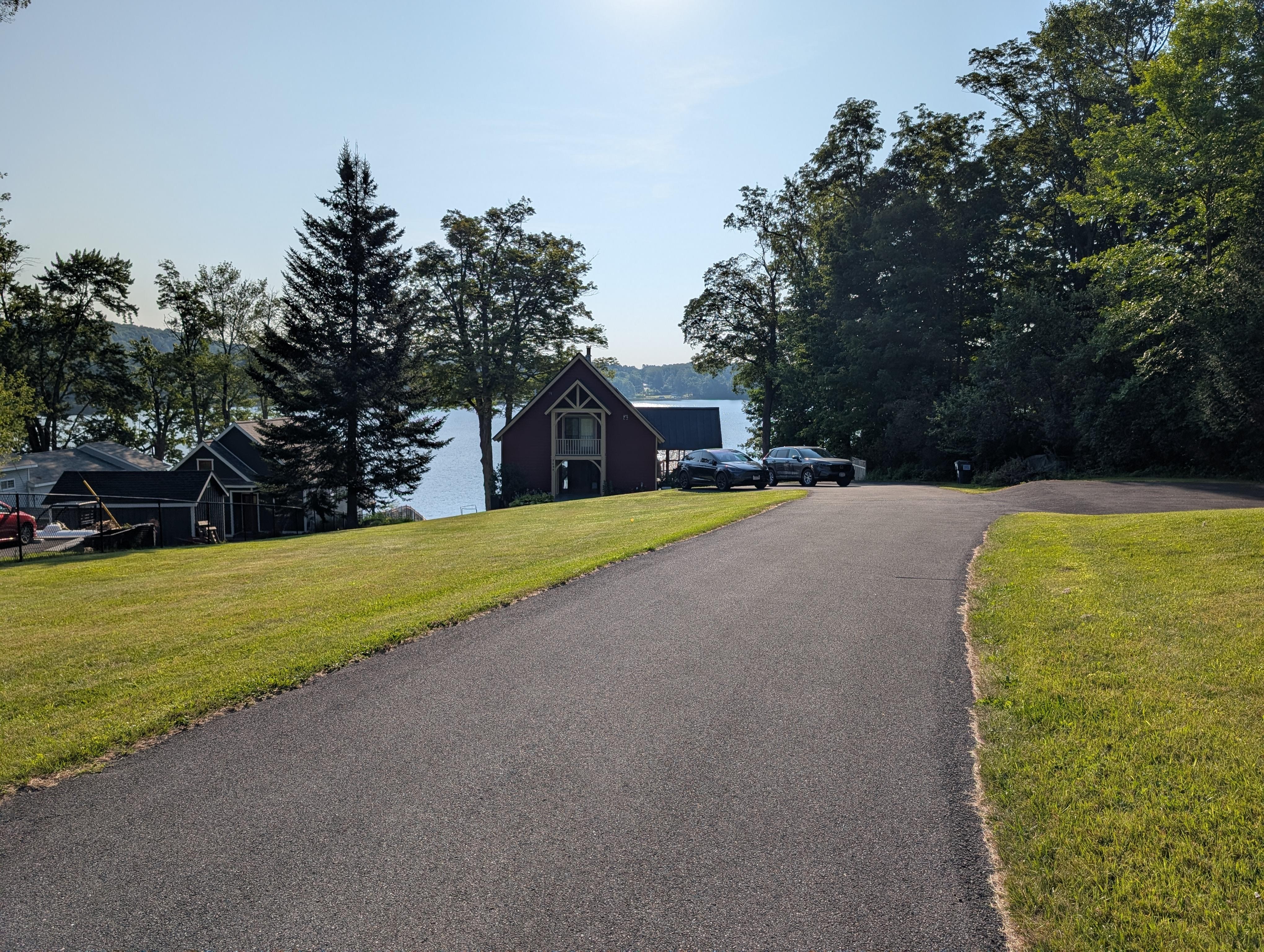 Long driveway and the lake behind the house 