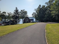 Long driveway and the lake behind the house