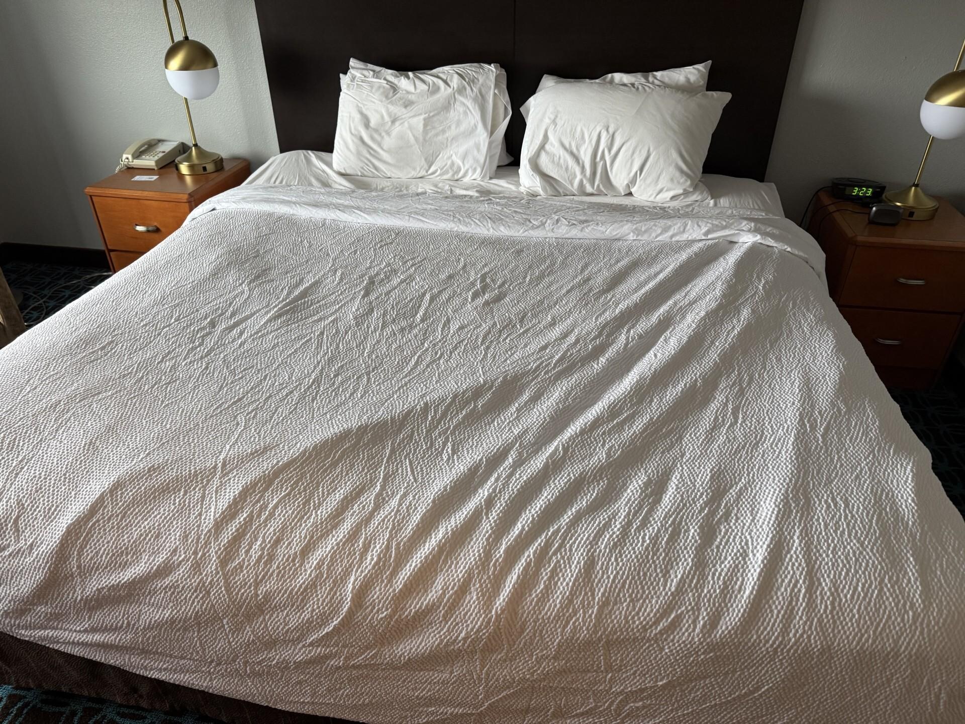 Our "freshly made" bed that we found when we got back to our room. 