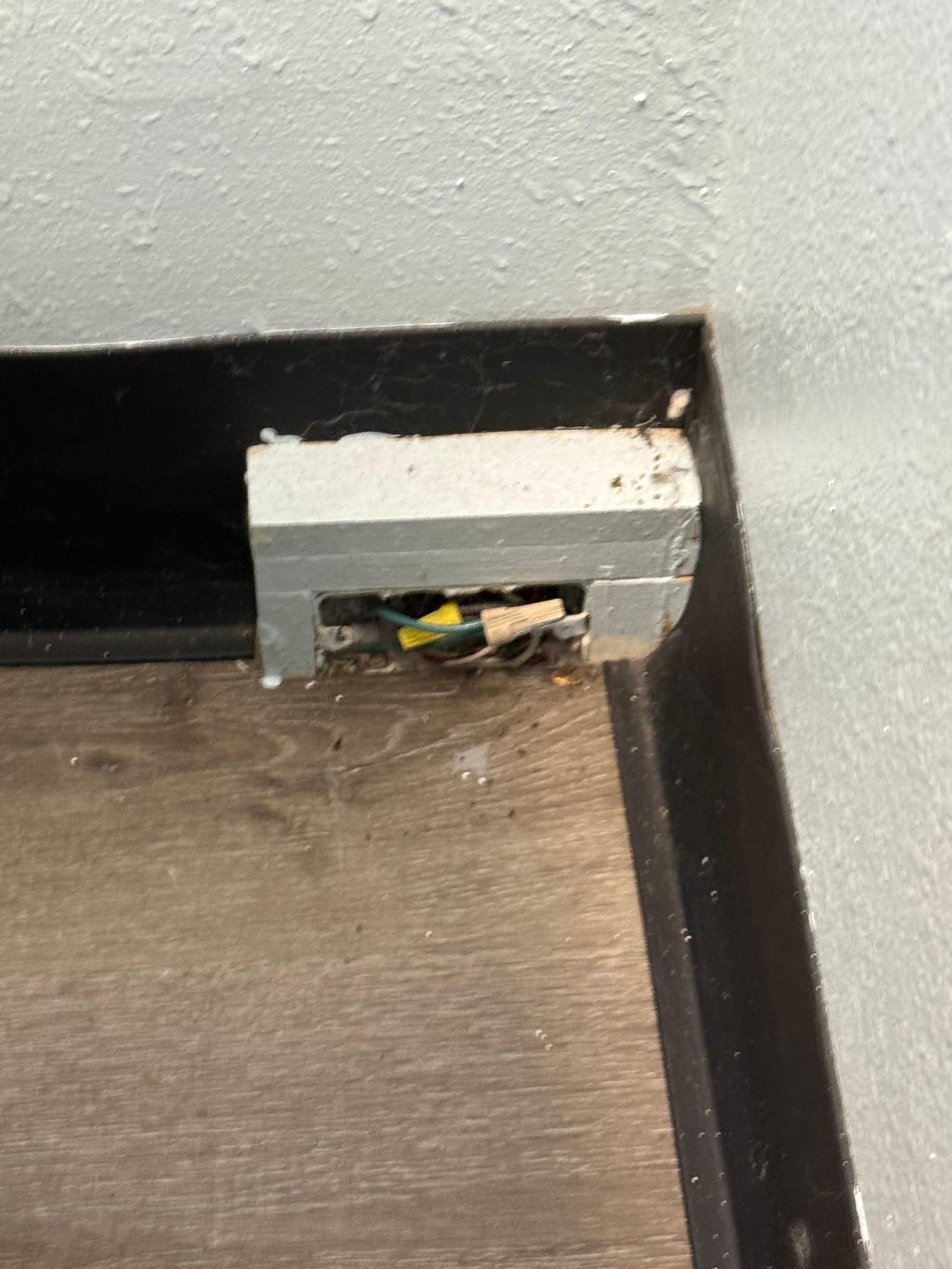 Exposed wires and some of the cob webs