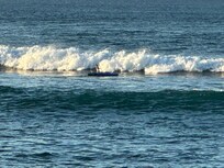 Surfing on the beach right there!