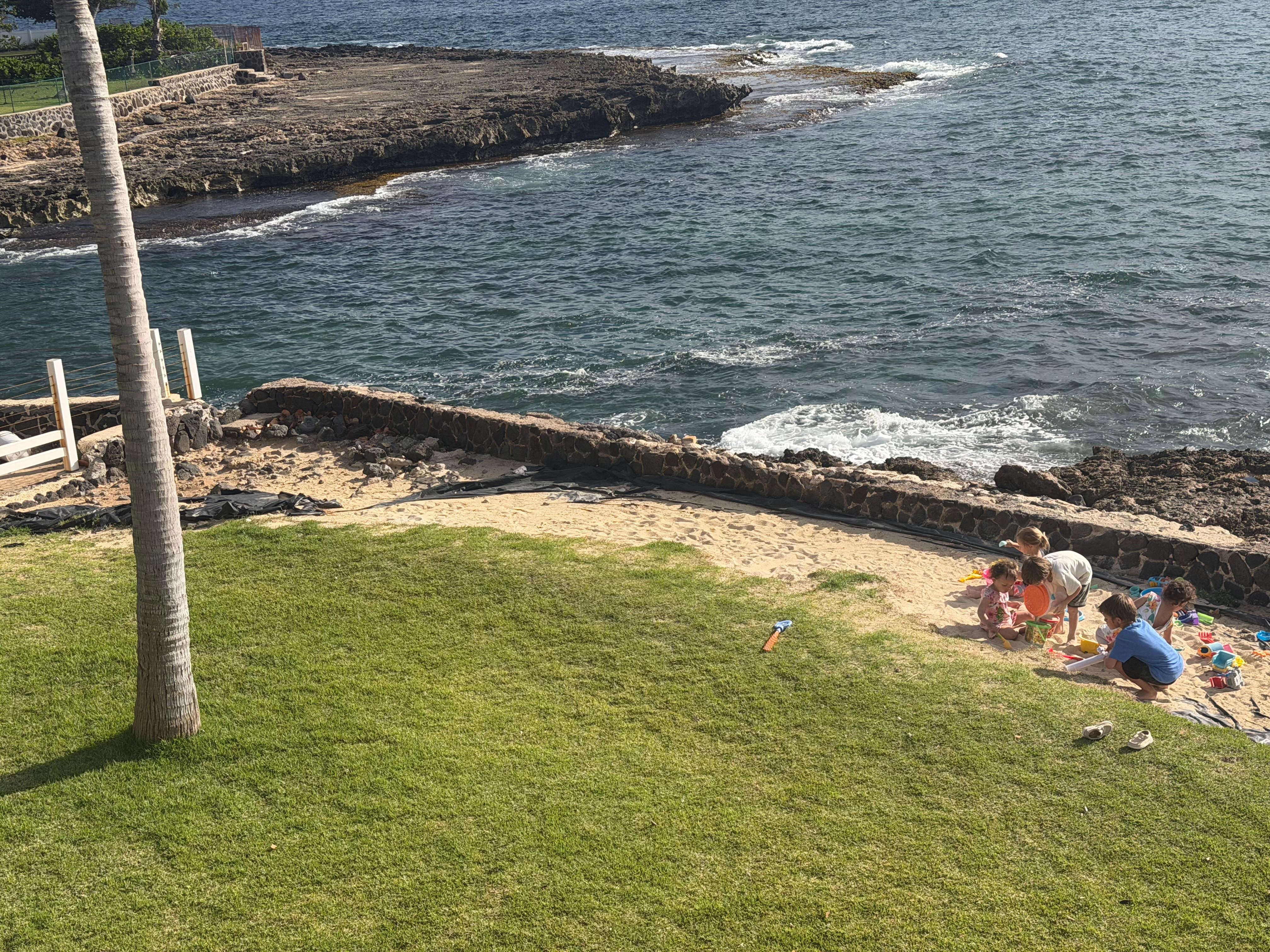 Looking down at kids playing on the lawn from the deck