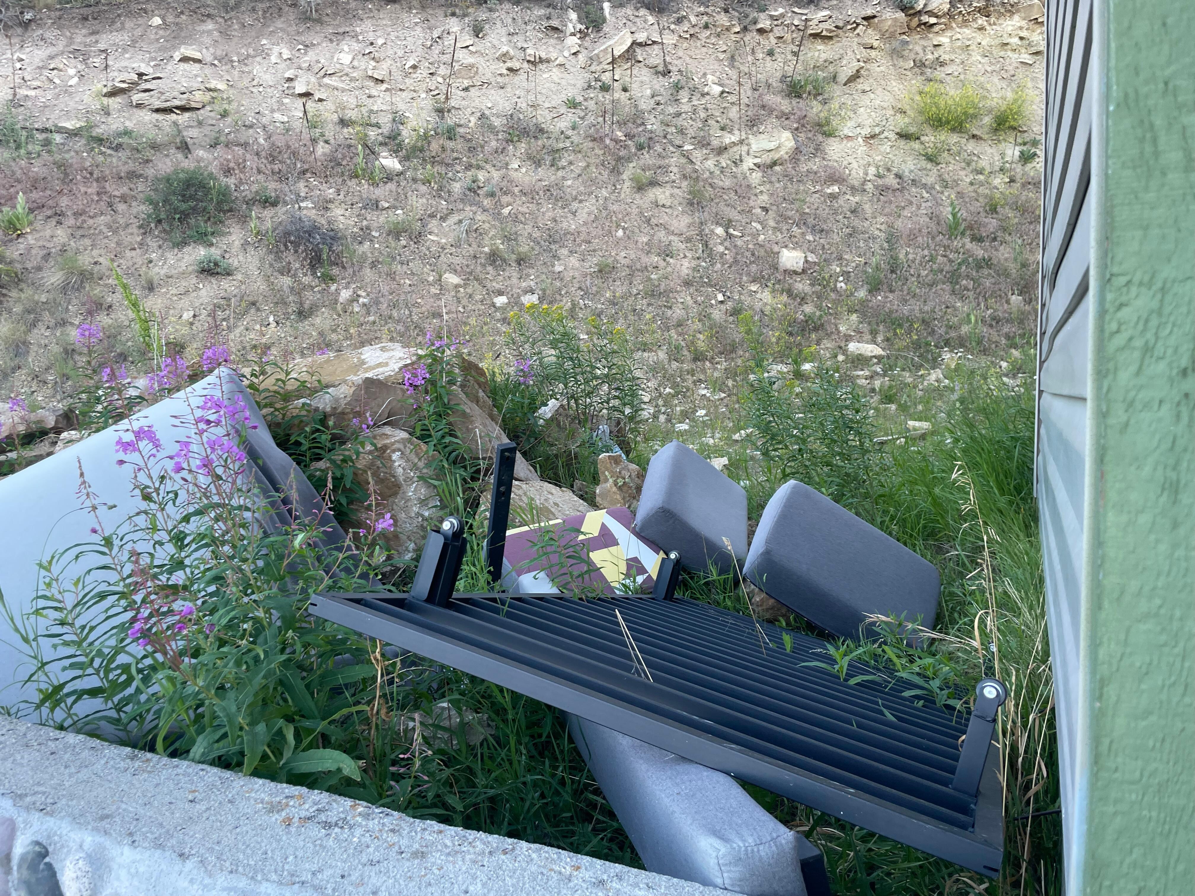 Abandoned furniture outside the hotel. 