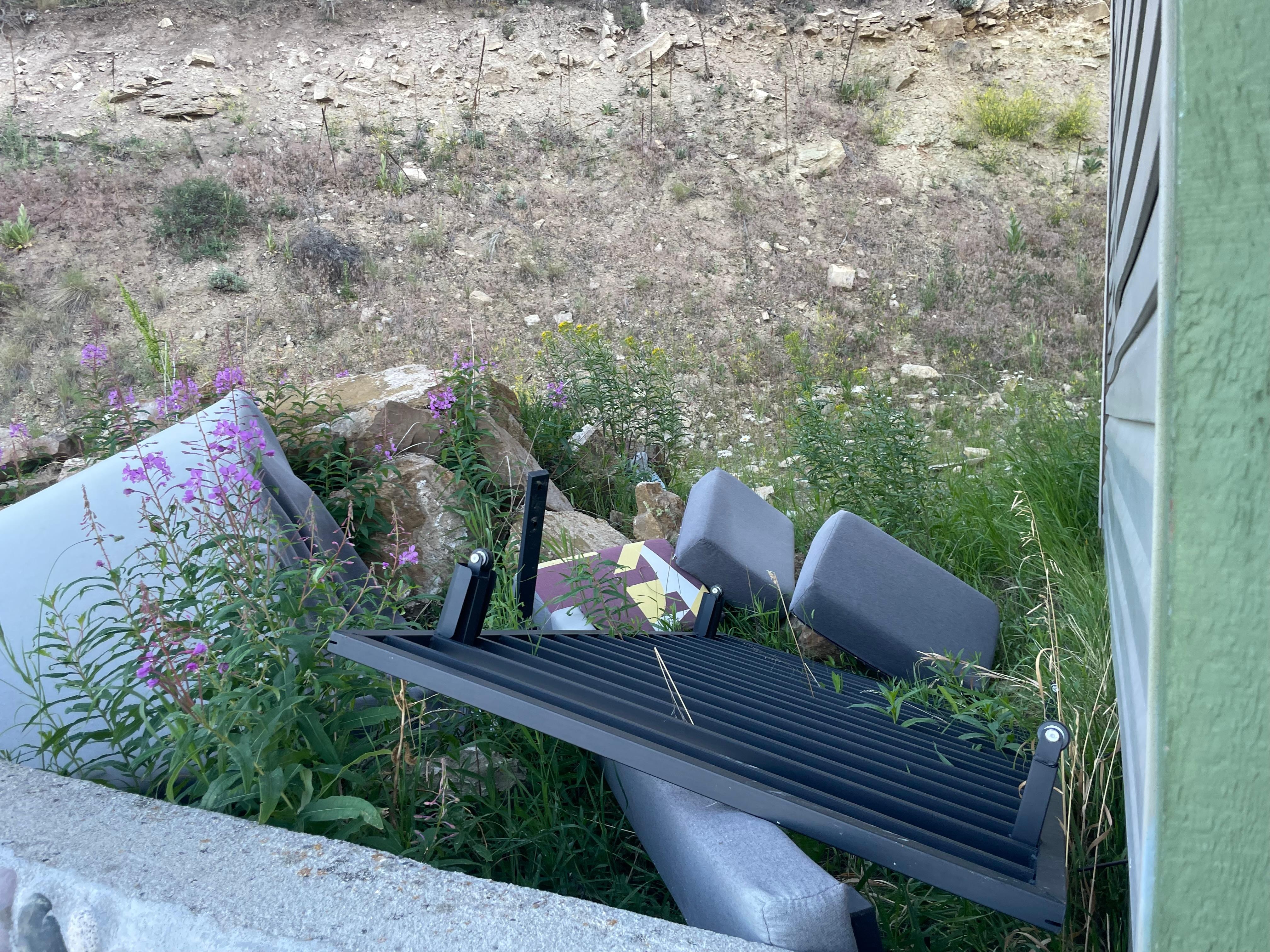 Abandoned furniture outside the hotel.