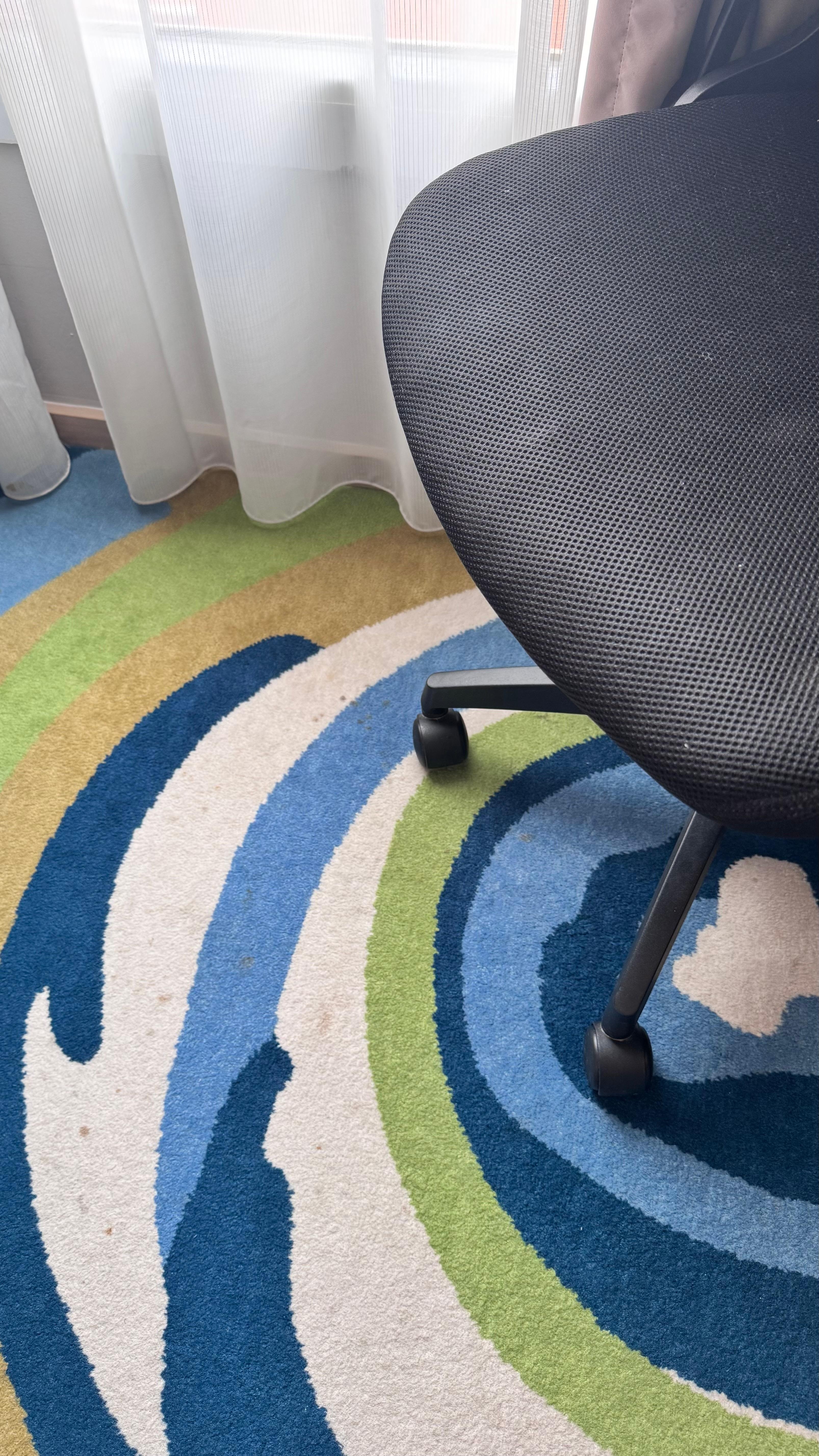 Dirty carpet and chair