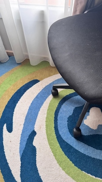 Dirty carpet and chair