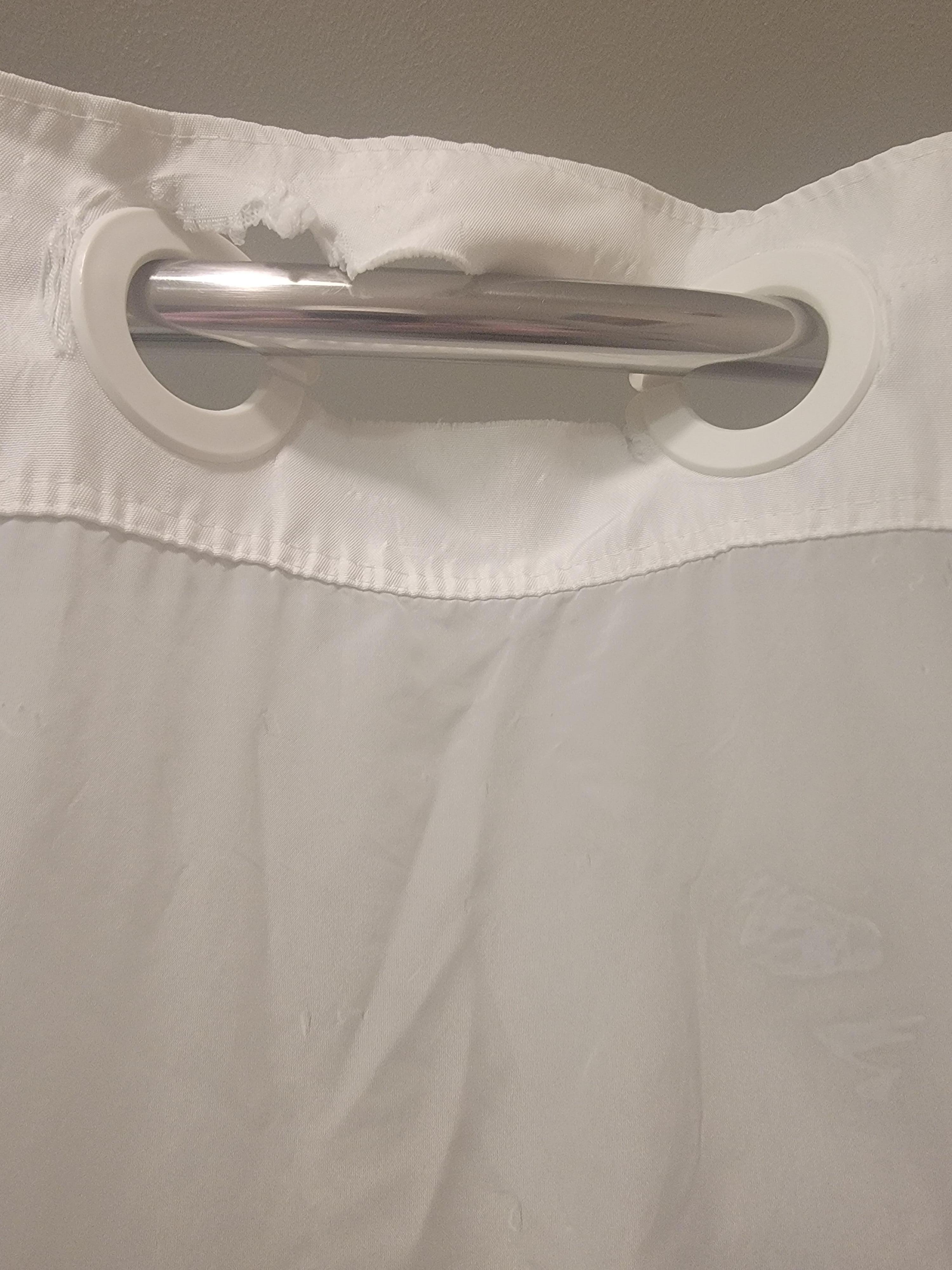 Ripped shower curtain