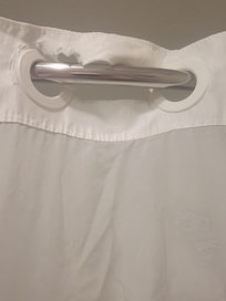 Ripped shower curtain