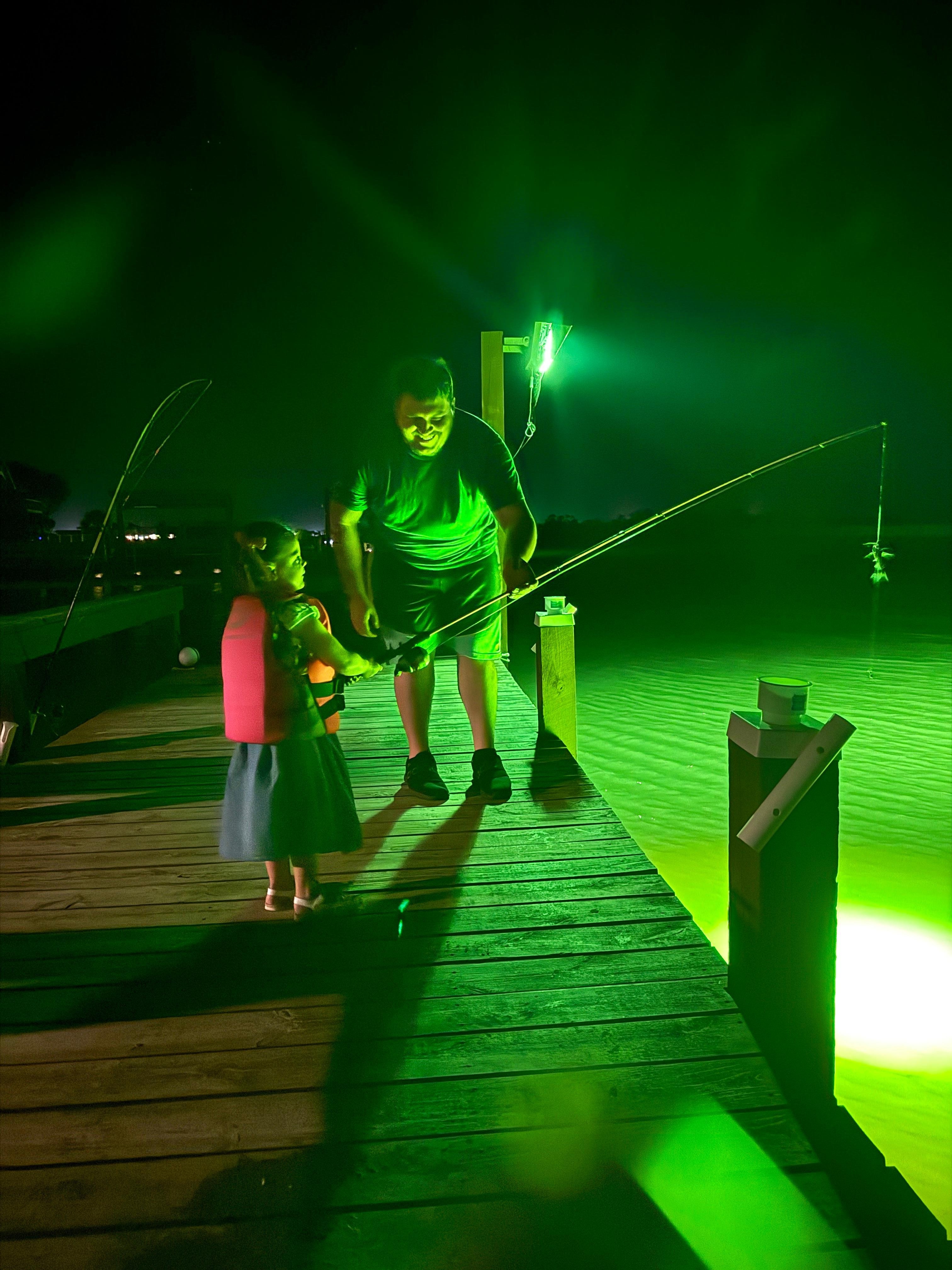 First time fisherman catching her first fish at the Trusty Trout!