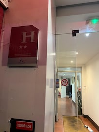 Picture of one of the no smoking signs that they ignore!