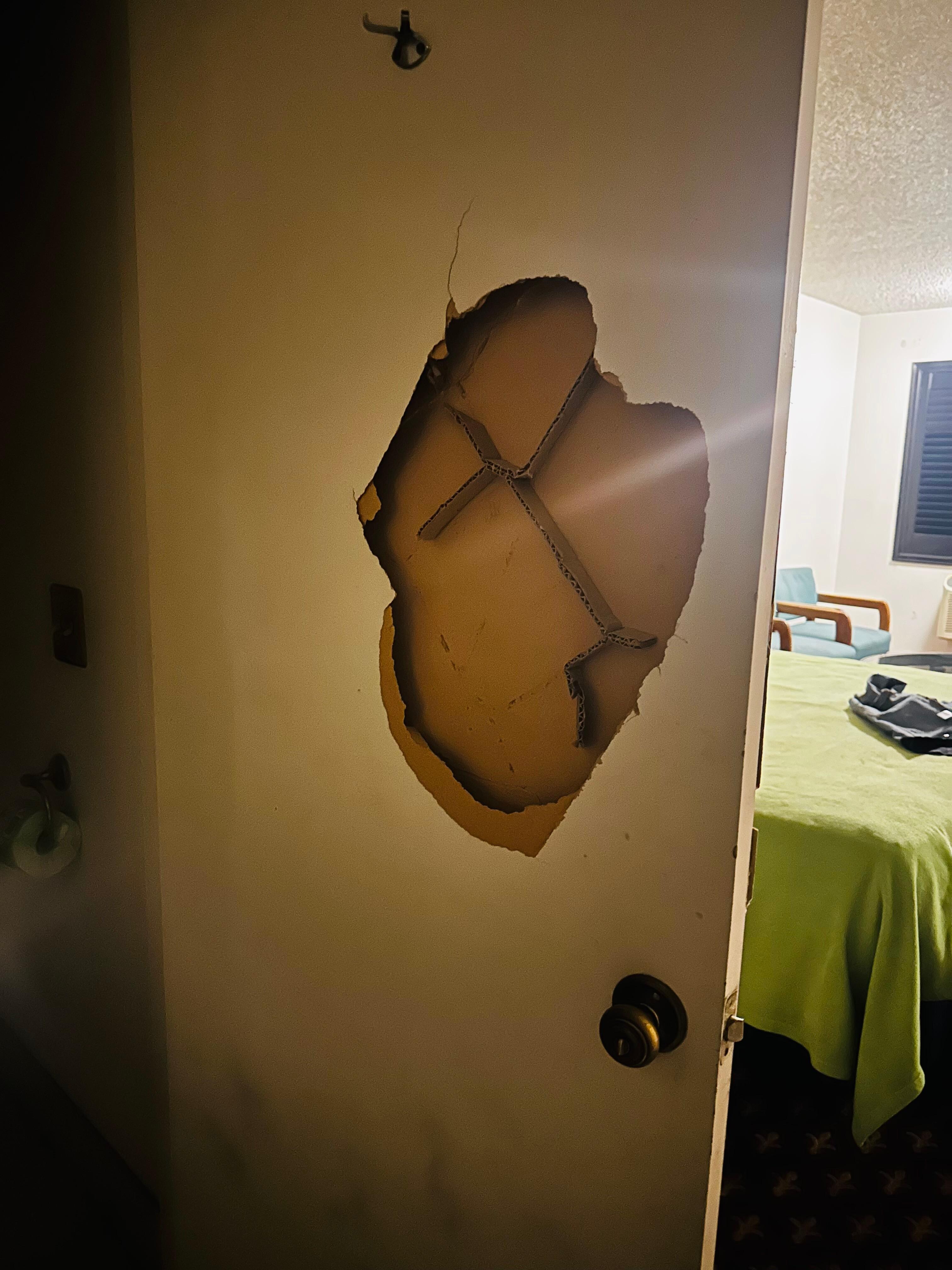 Walls and door damaged and bed mattress had blood stains 