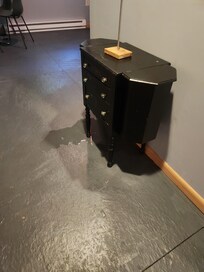 The wall connected to the bathroom with water leaking.