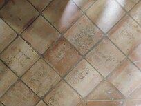 Road tar in hallway next to bathroom