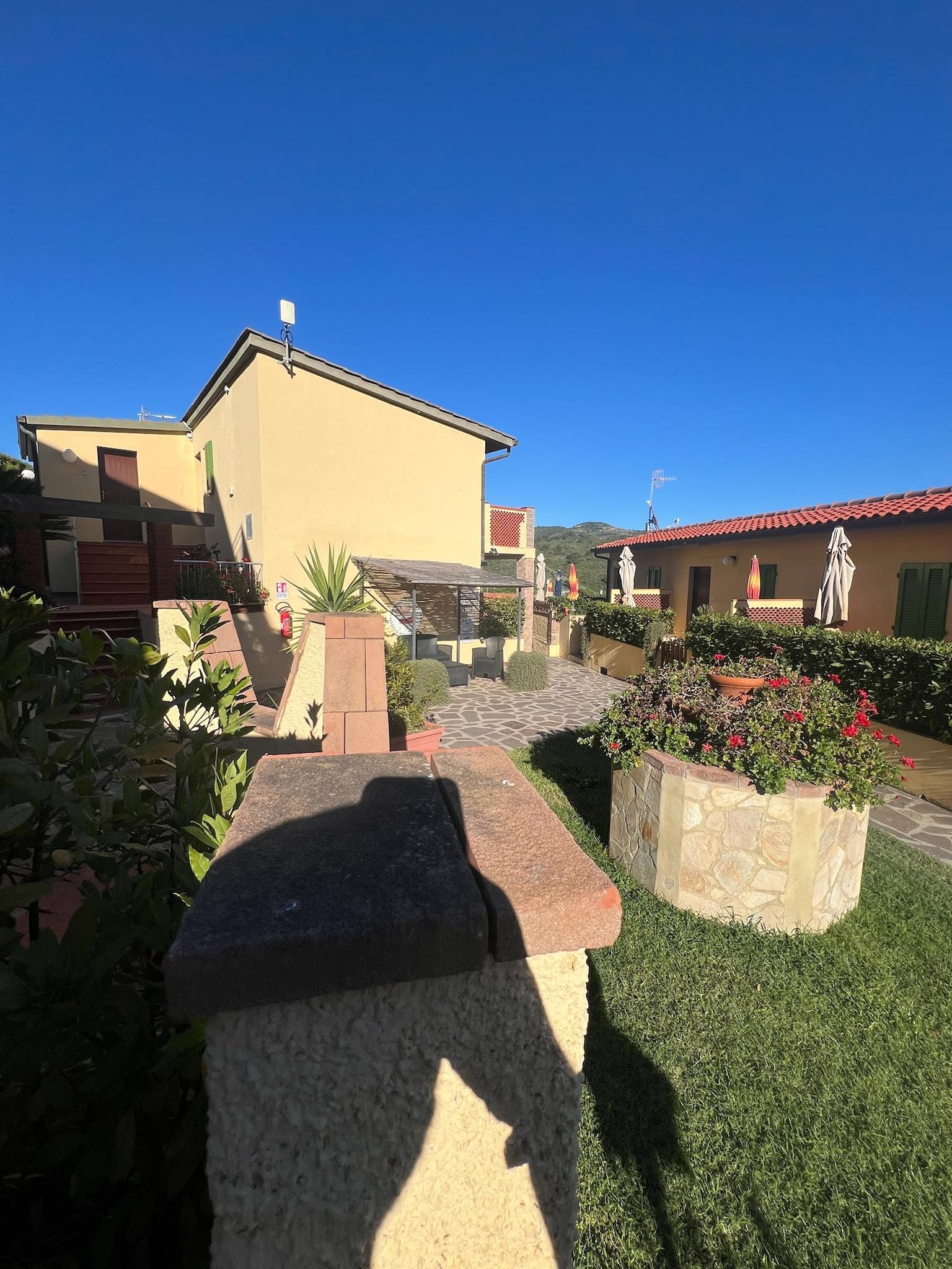 Looking towards reception from our porch. They had the best cappuccinos at the “bar” there