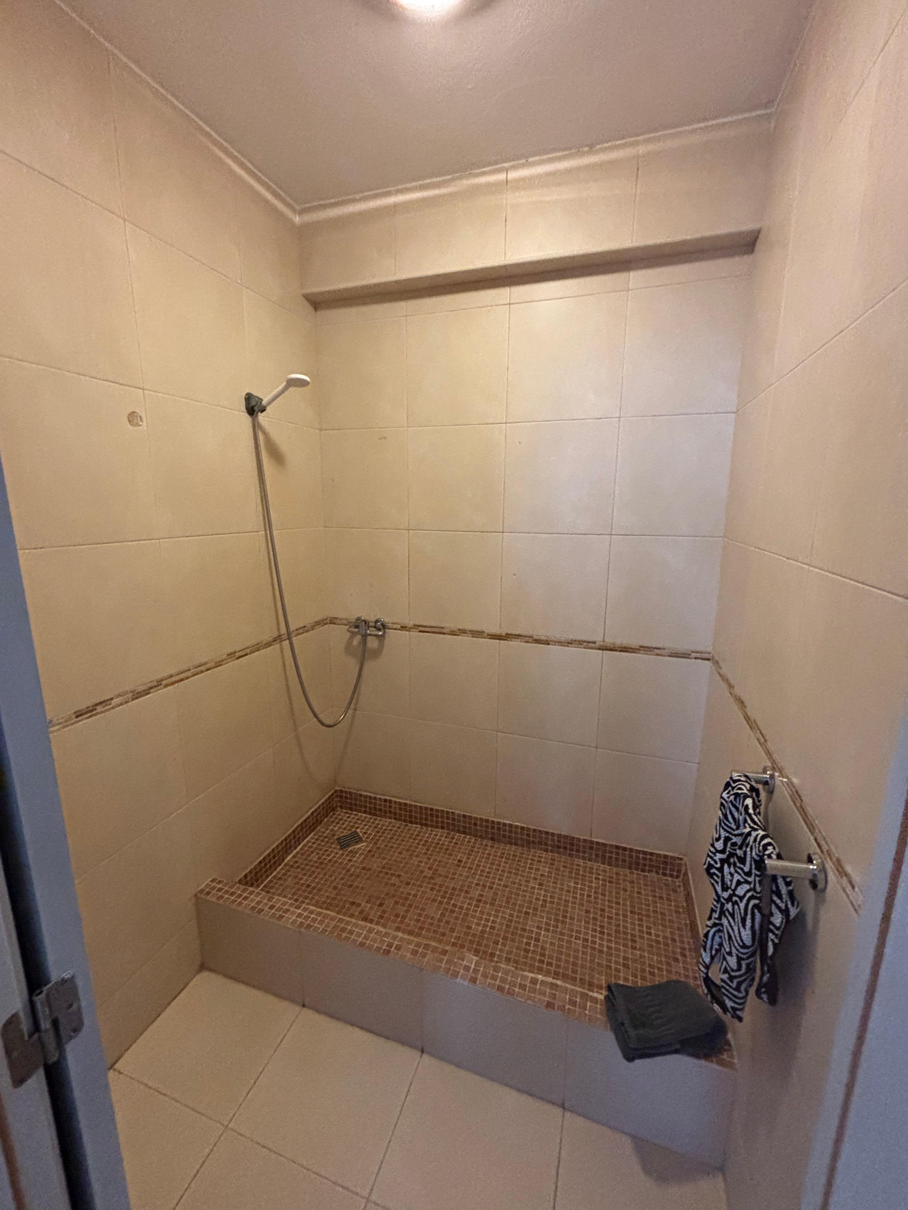 Shower with no curtain, after a storm is smelt so bad we closed the door and never used again