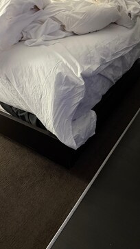 Bed on right, fitted under with flat on top.