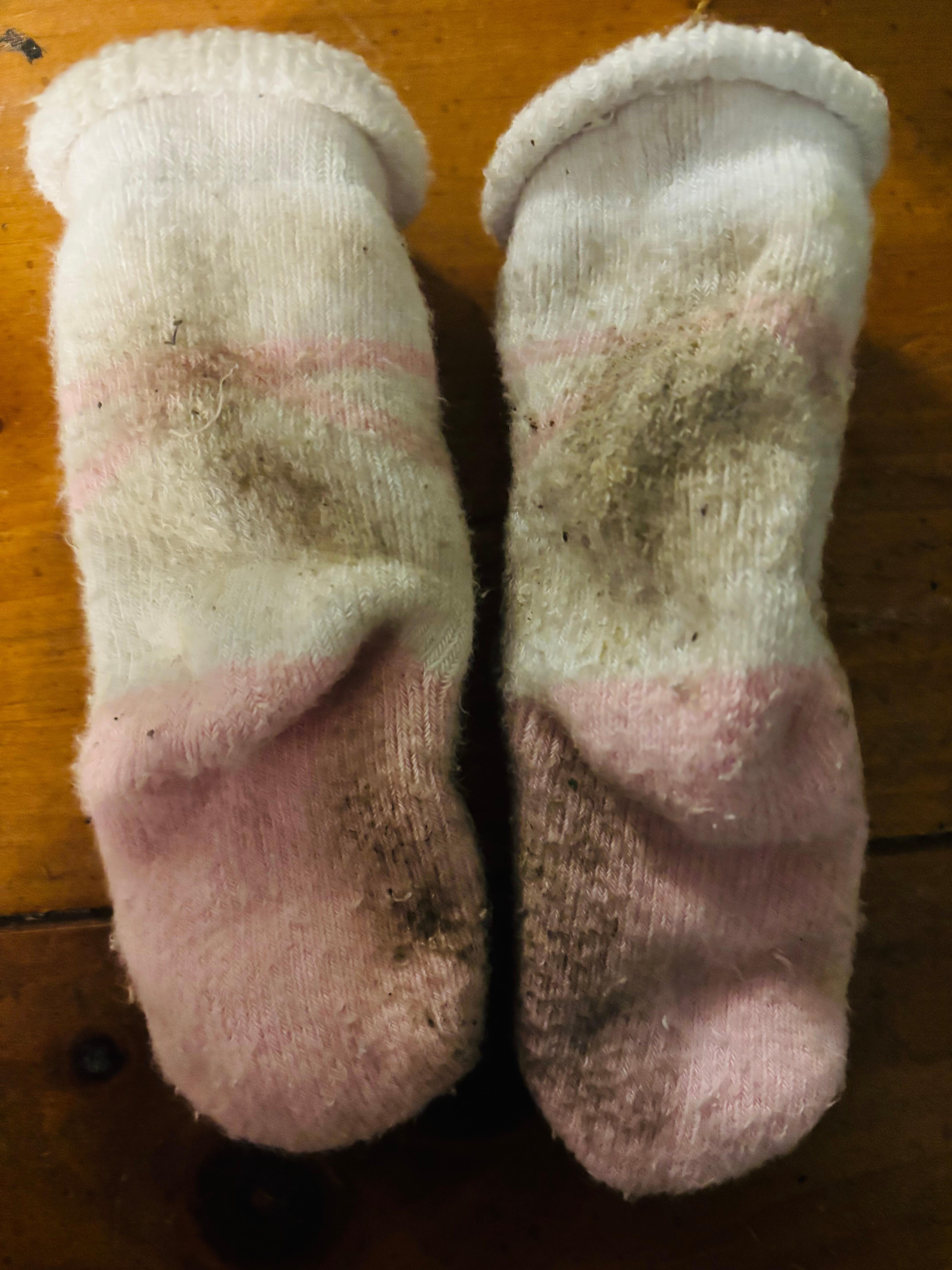 Our baby’s brand new socks after sitting just an hour on the floor.