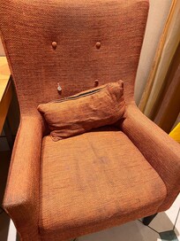 Lobby chair tattered and torn