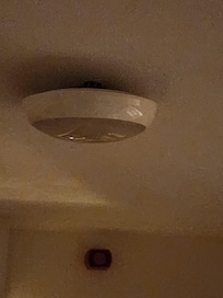 Light fixture hanging and not attached