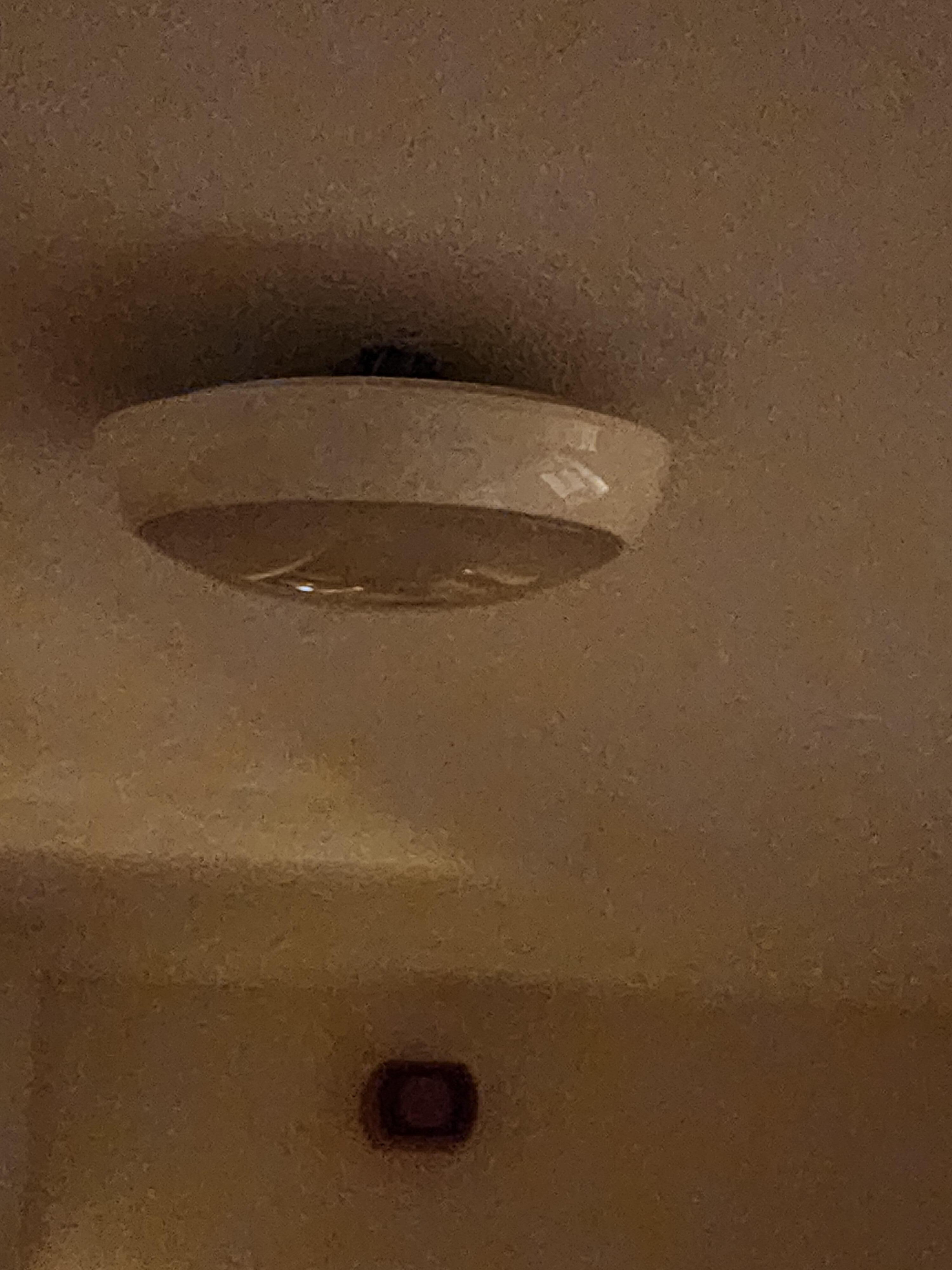 Light fixture hanging and not attached