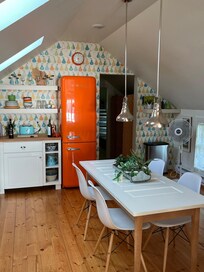 Love the kitchen especially the vintage-looking orange fridge.