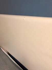 Headboard had rip as well as dirty.