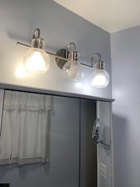 master bathroom had 2 of the 3 functioning lights...that was a win! Linen closet inside was empty aside from the dead bugs and bathroom fixture hardware inside