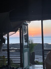 View from inside beach front room towards the beach.