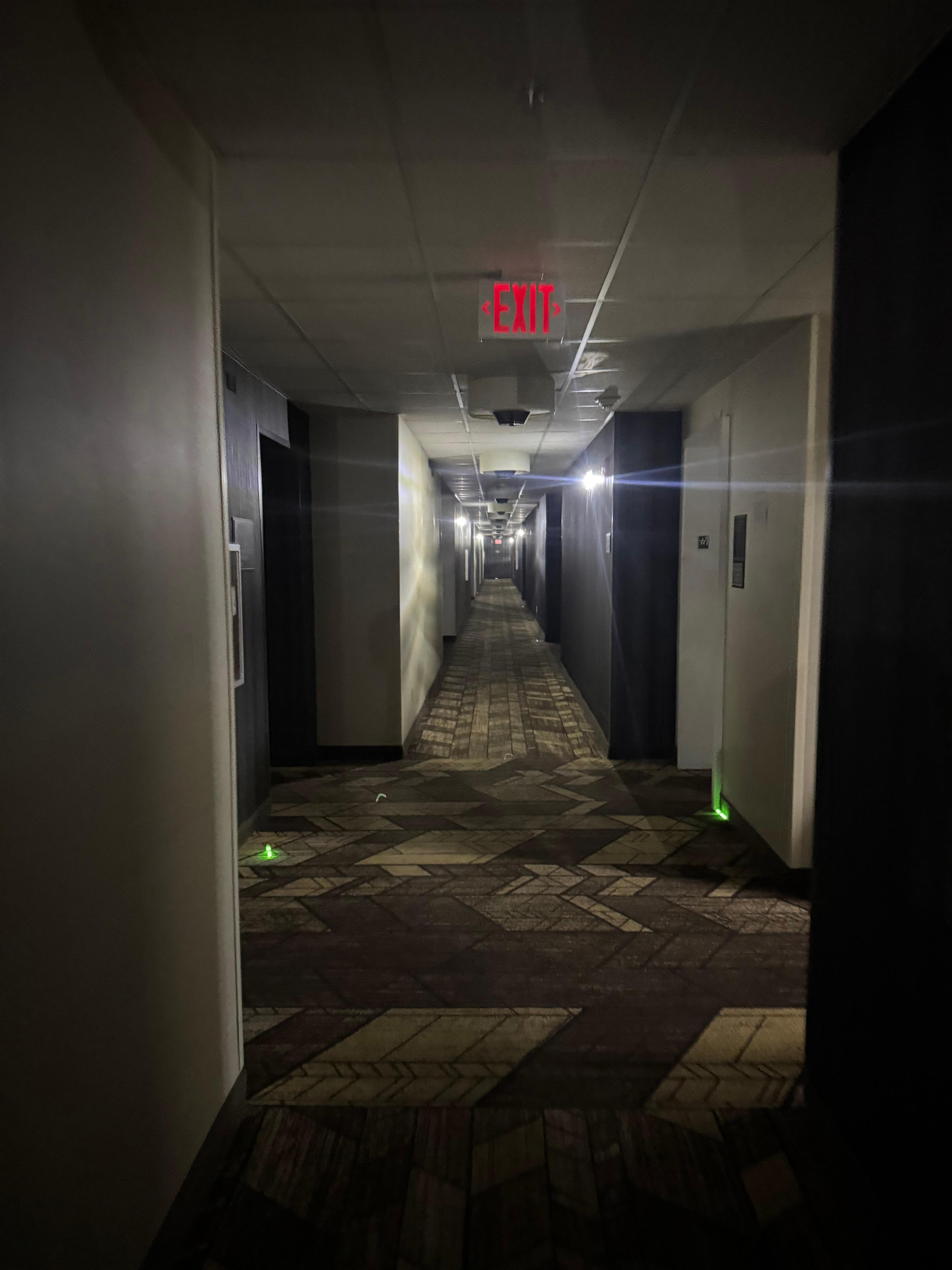 Hallways dark and being lit with glow sticks 