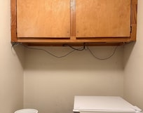 Cat5 cables hanging out of locked cabinet if your gonna spy at least be discreet