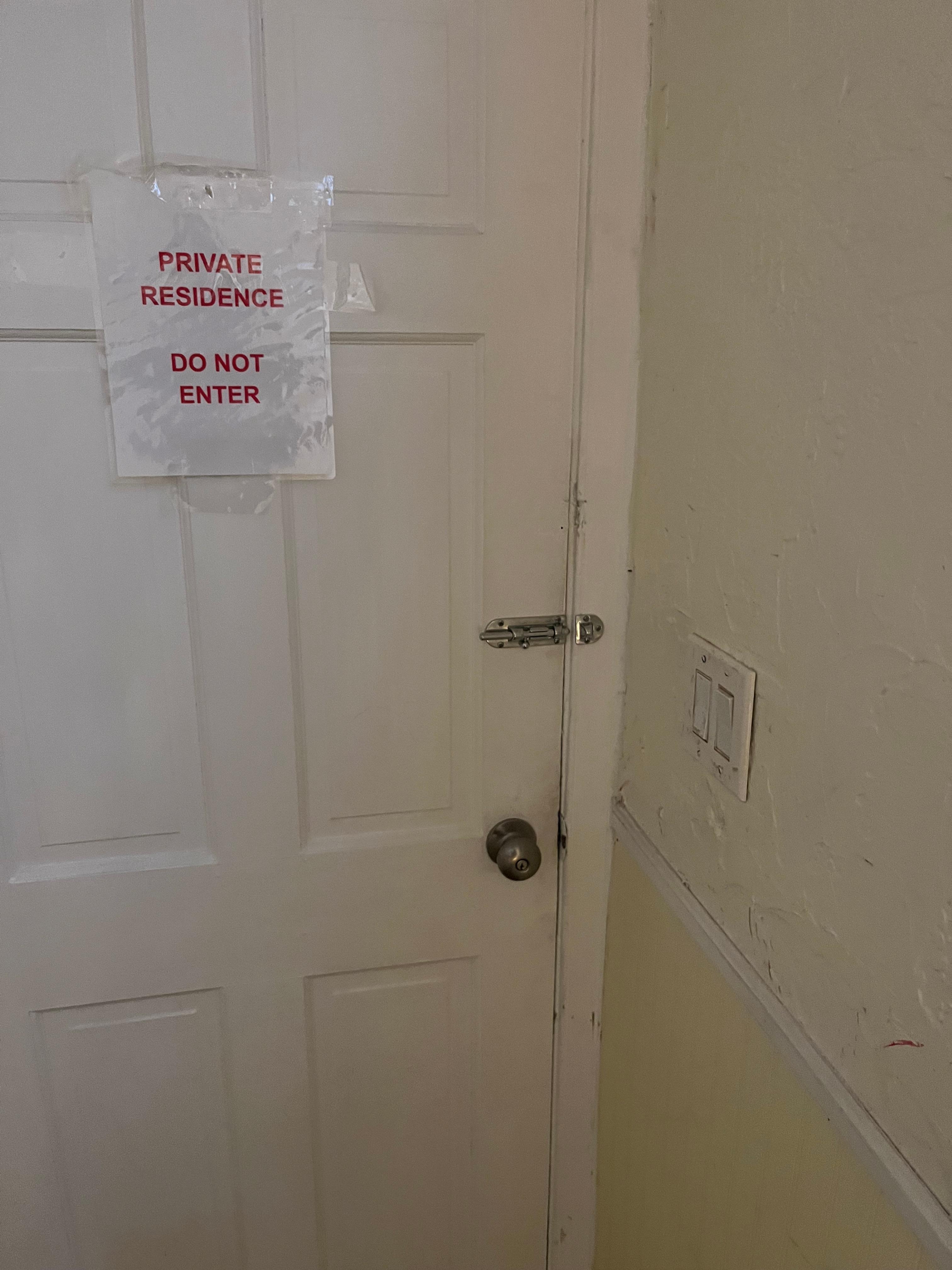 Weird door to first floor tenant. Opens straight into our hallway. 