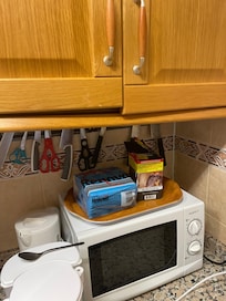 Broken cabinet hanging off the wall