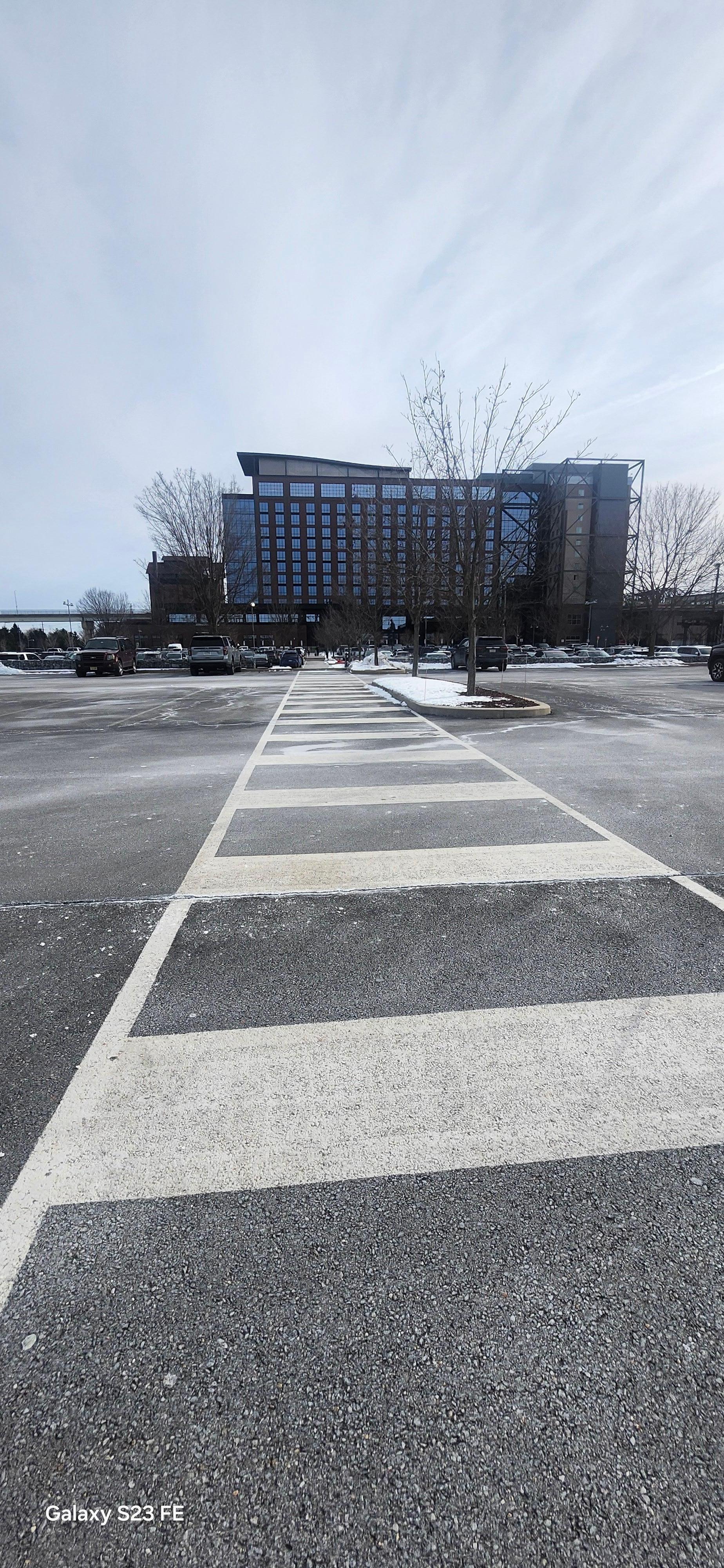 Walkway in the parking lot leading to hotel entrance