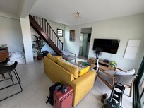 This picture shows the living room with the TV. We used our own streaming service to watch movies.