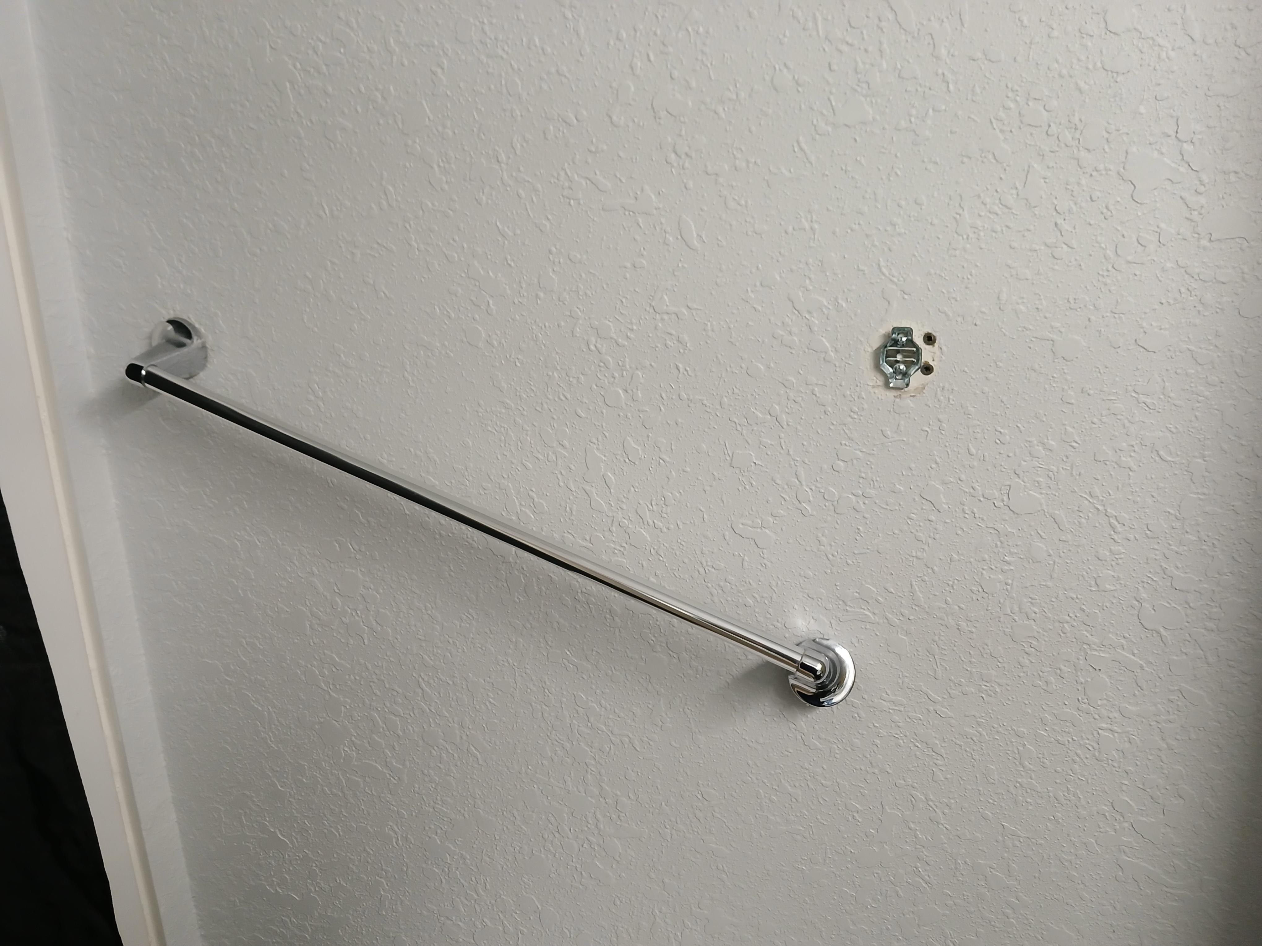 Broken towel rail in bathroom