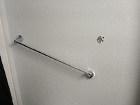 Broken towel rail in bathroom