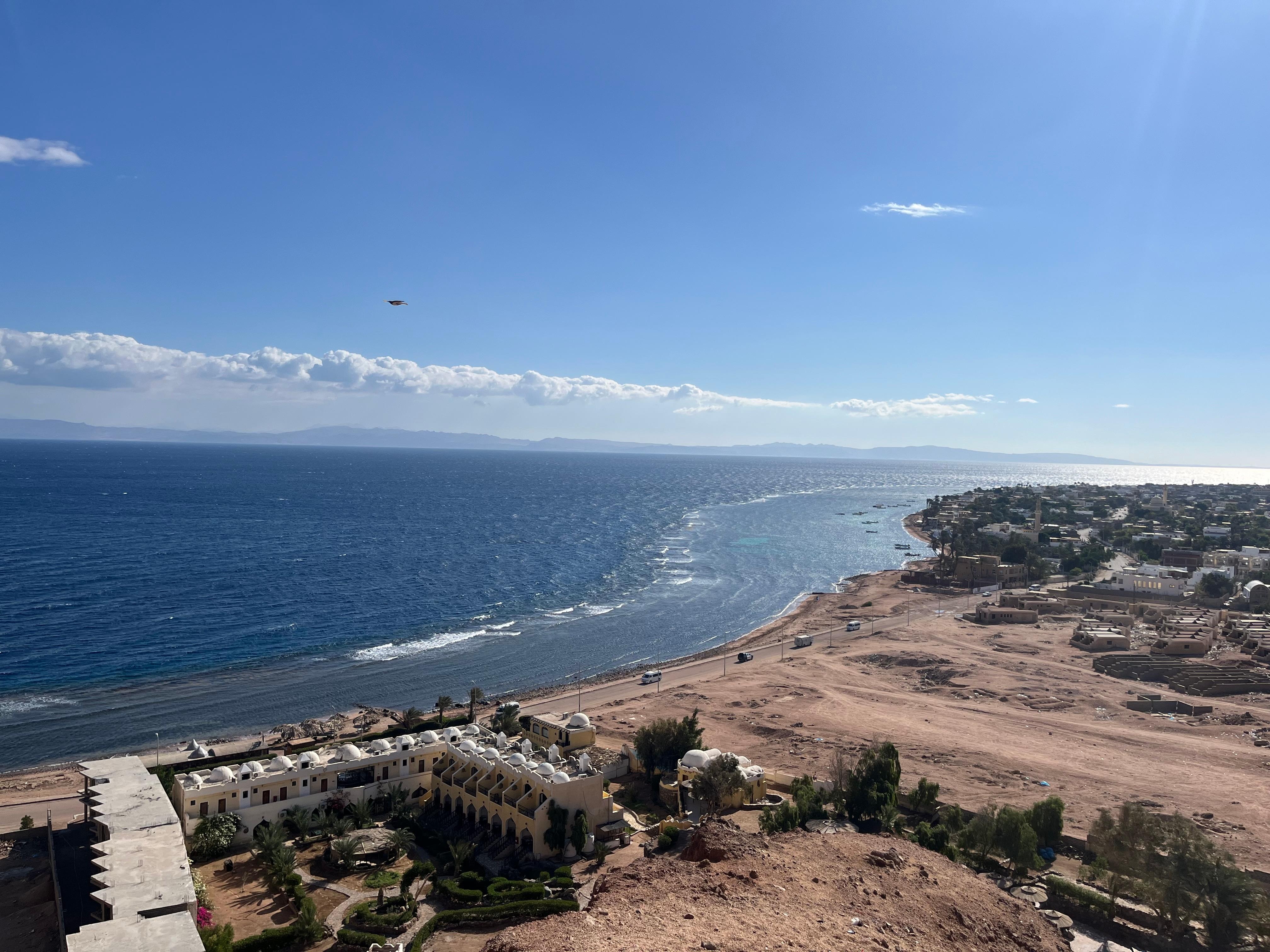 The view of the hotel from the mountain behind it.