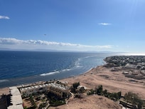 The view of the hotel from the mountain behind it.